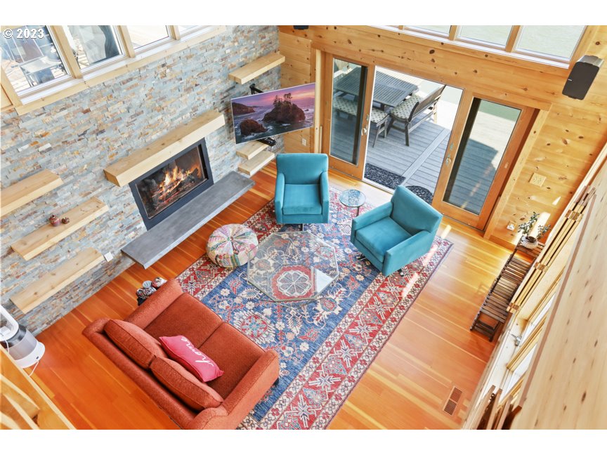 111 North Bridgeton Road, Unit E05 Portland, OR 97217 - Photo 32 of 42 view of living room with furniture and a fireplace