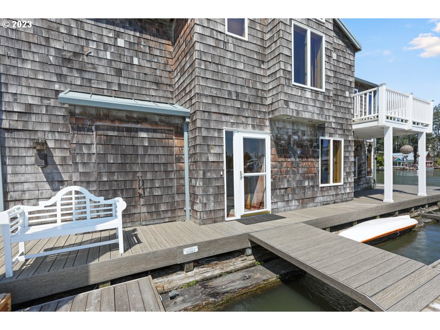 111 North Bridgeton Road, Unit E05 Portland, OR 97217 - Photo 10 of 42 a view of a wooden deck and city view