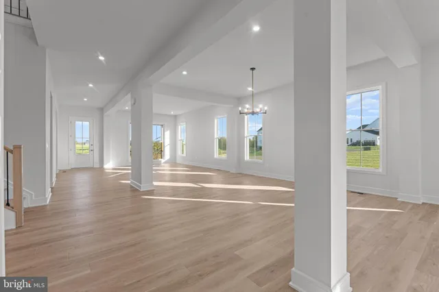 a bathroom with a double vanity sink and mirror with window