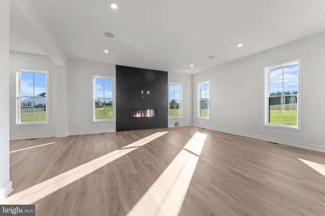 a bathroom with a tub a sink and a window