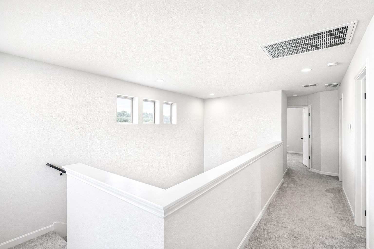 940 Paddock Lane Georgetown, TX 78626 - Photo 21 of 32 Upper-level hallway featuring light gray carpeting and white walls
