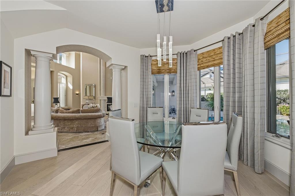 355 Sedgwick Court Naples, FL 34108 - Photo 15 of 48 a view of a livingroom with furniture window and wooden floor