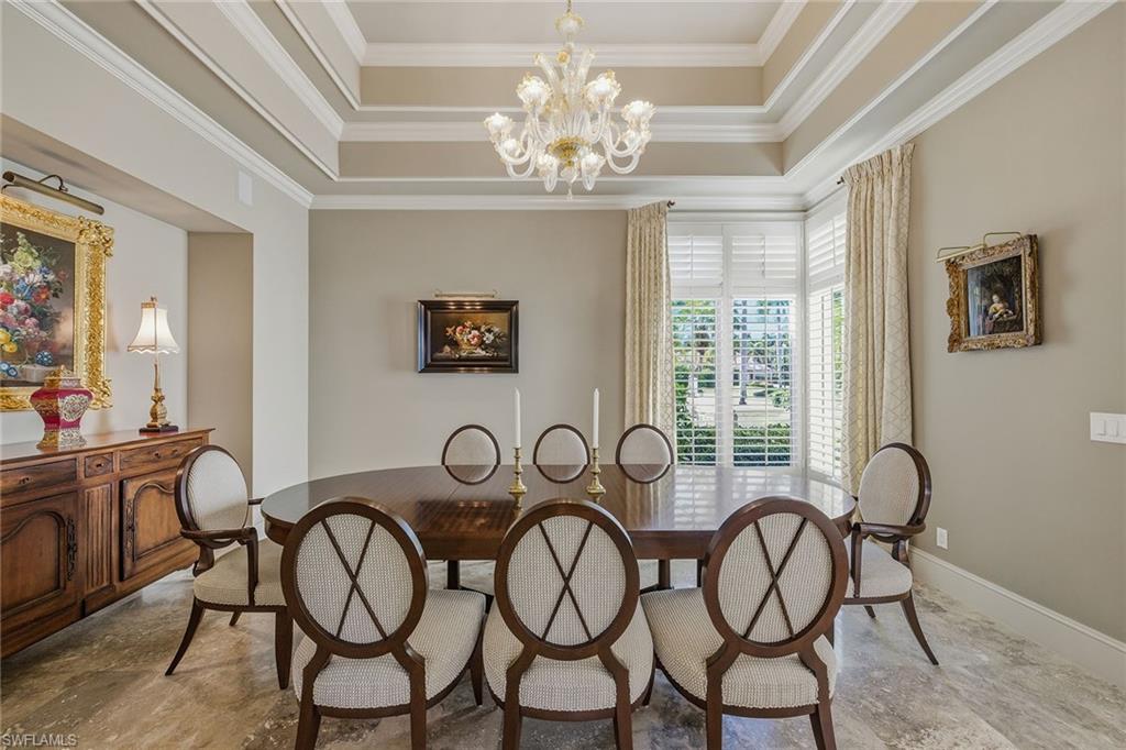 355 Sedgwick Court Naples, FL 34108 - Photo 17 of 48 a room with chandelier fan and windows