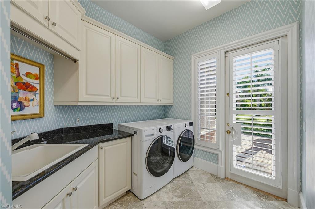 355 Sedgwick Court Naples, FL 34108 - Photo 31 of 48 a utility room with dryer and washer