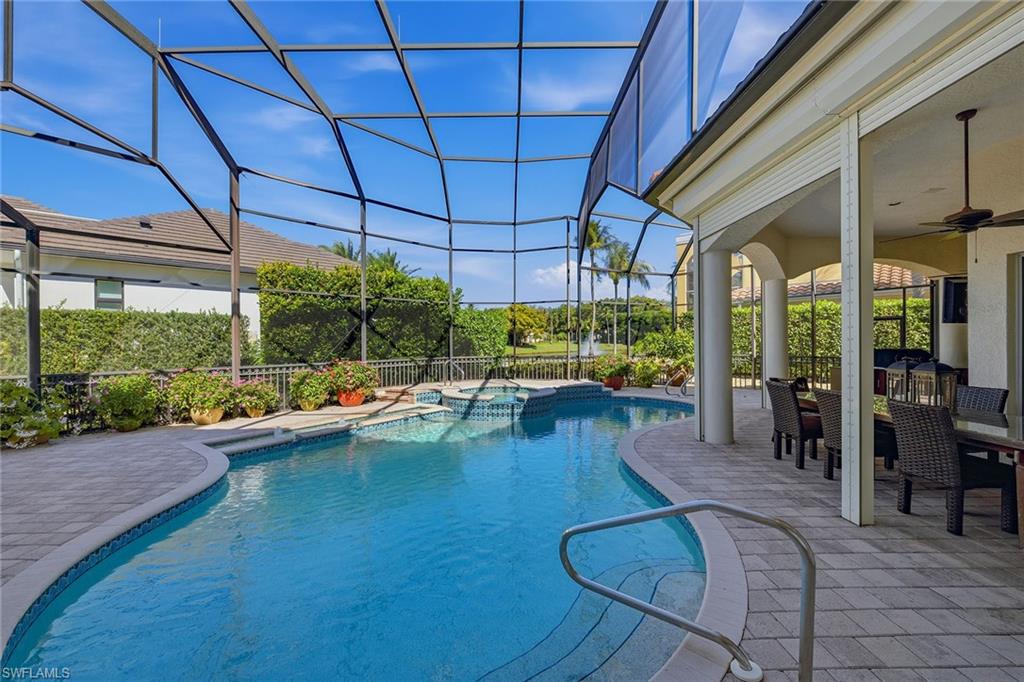 355 Sedgwick Court Naples, FL 34108 - Photo 36 of 48 a living room with patio furniture and a large window