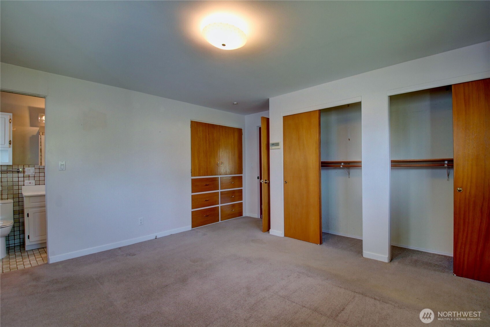 5121 West Highland Road Everett, WA 98203 - Photo 24 of 36 an empty room with closet and a fireplace