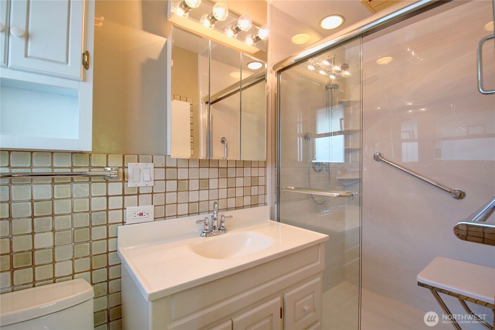 5121 West Highland Road Everett, WA 98203 - Photo 25 of 36 a bathroom with a sink a toilet and shower