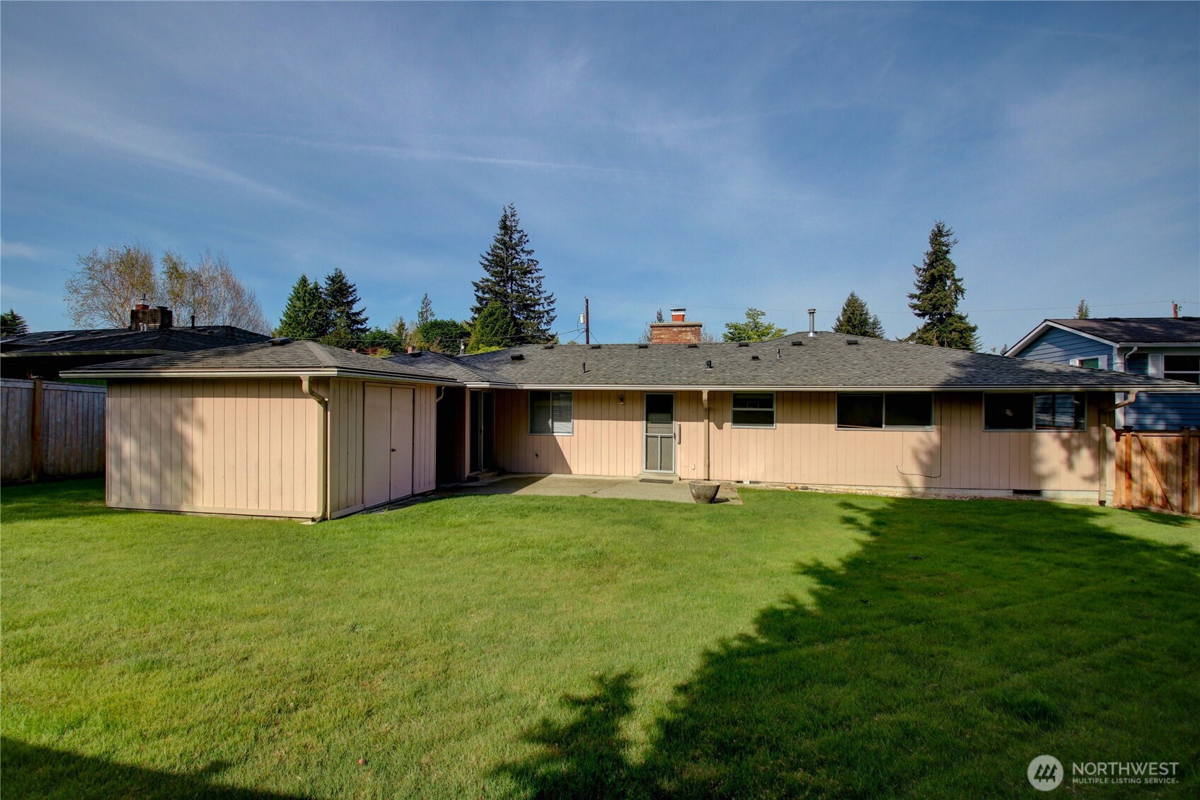 5121 West Highland Road Everett, WA 98203 - Photo 30 of 36 a front view of a house with a yard and a garage