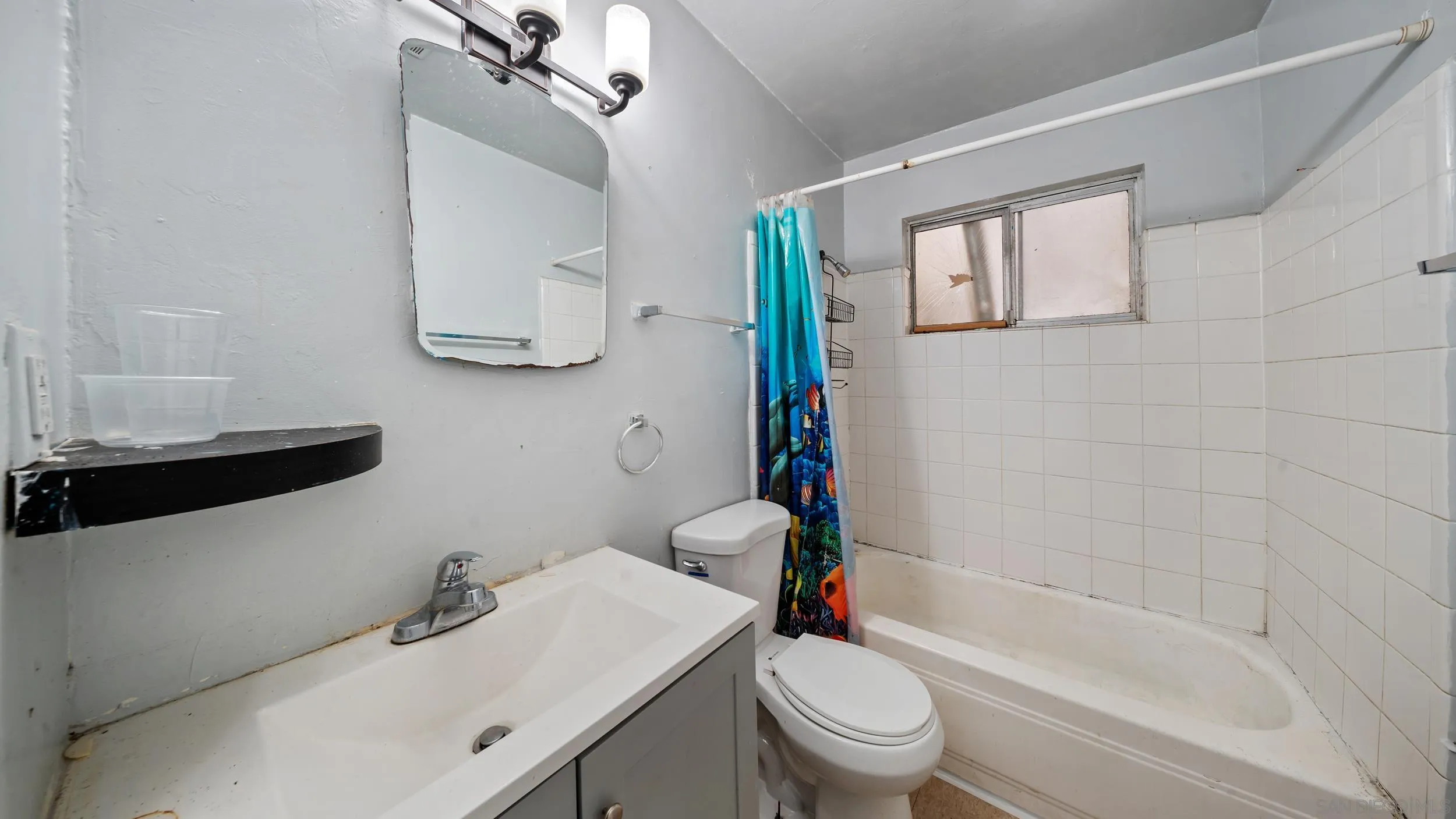 2839 Emerald Drive Oceanside, CA 92056 - Photo 12 of 32 a bathroom with a sink toilet and shower