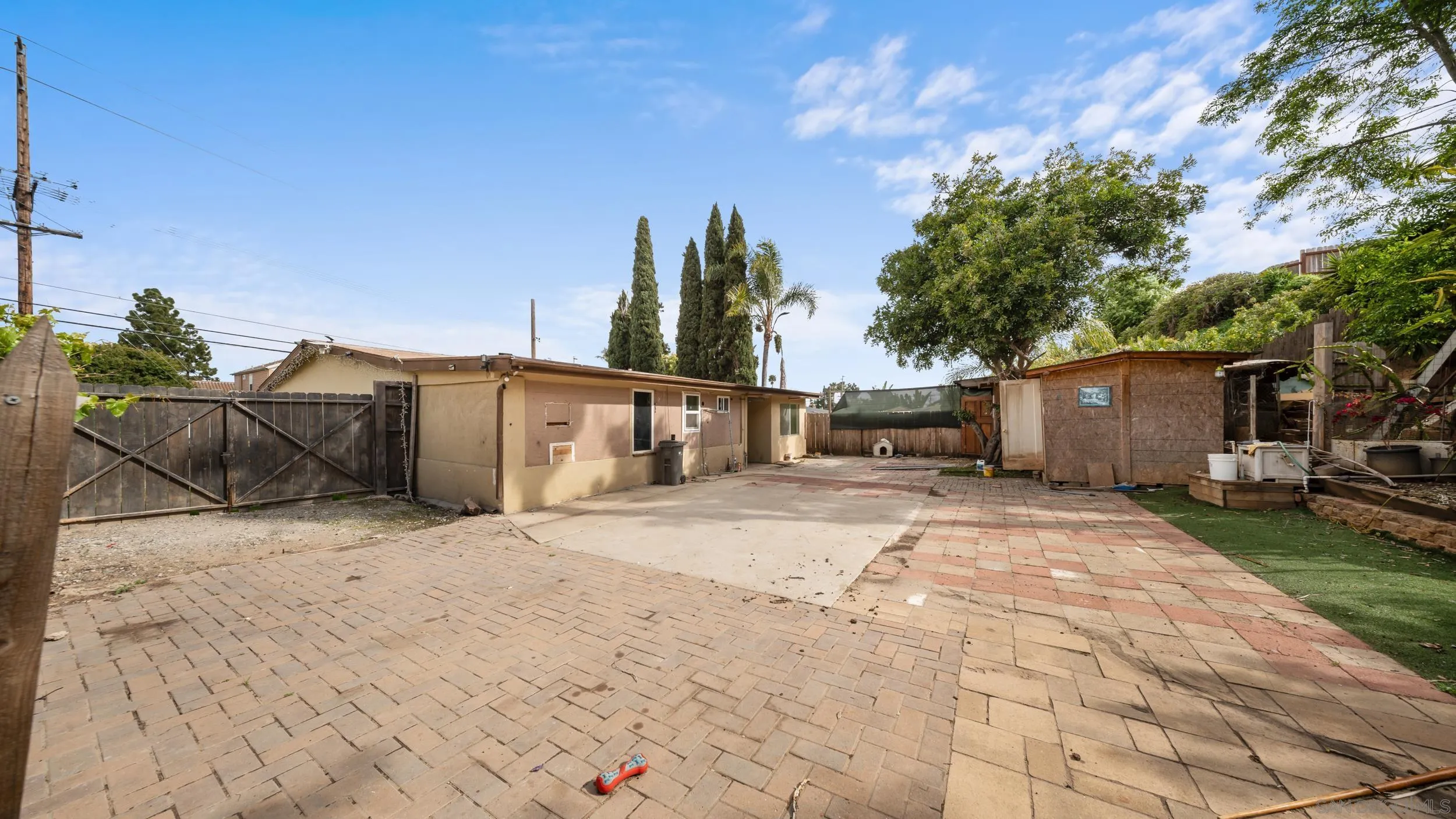 2839 Emerald Drive Oceanside, CA 92056 - Photo 25 of 32 a front view of a house with a yard and trees
