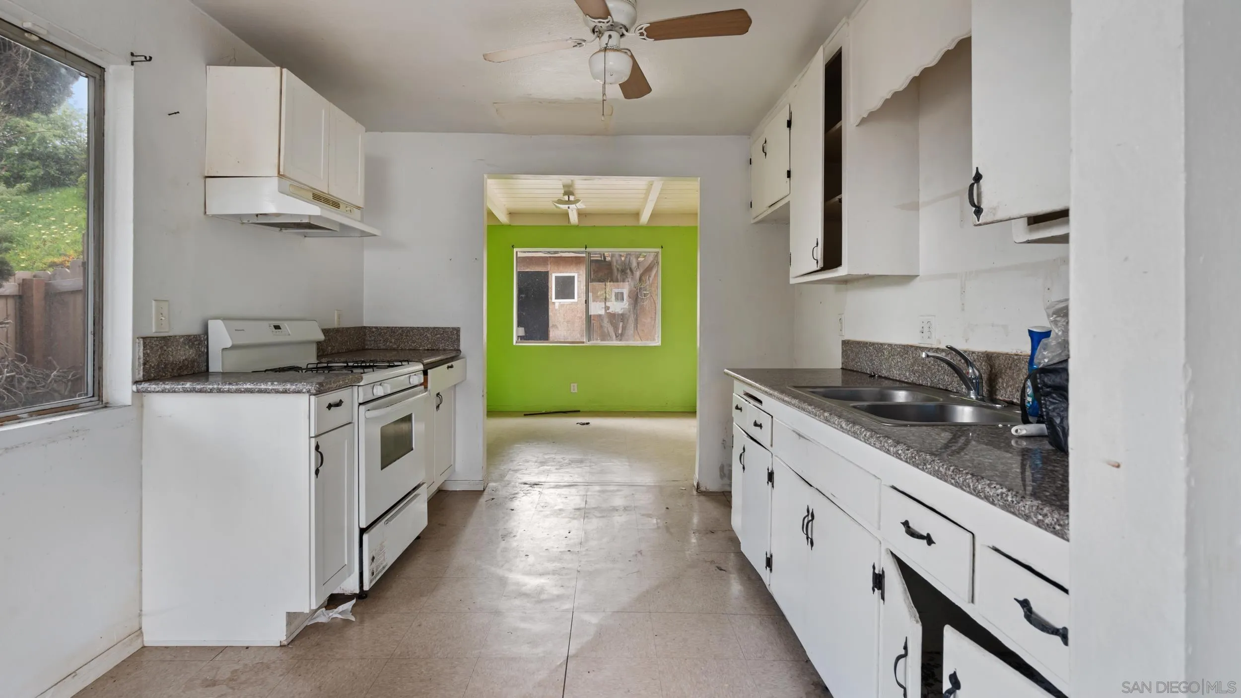 2839 Emerald Drive Oceanside, CA 92056 - Photo 6 of 32 a kitchen with stainless steel appliances granite countertop a stove and a sink
