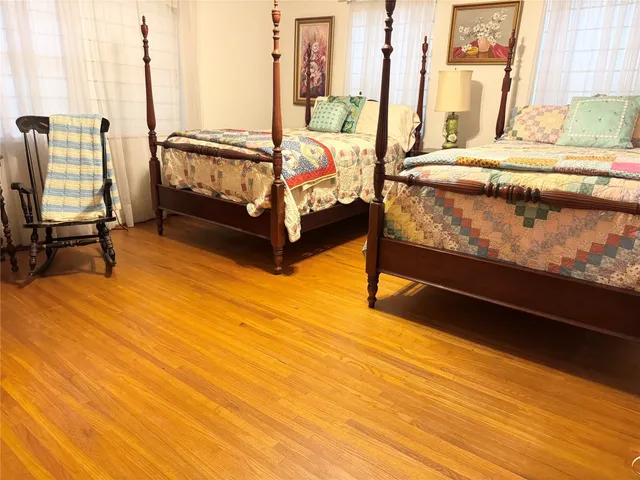 a bed room with a bed and a chandelier