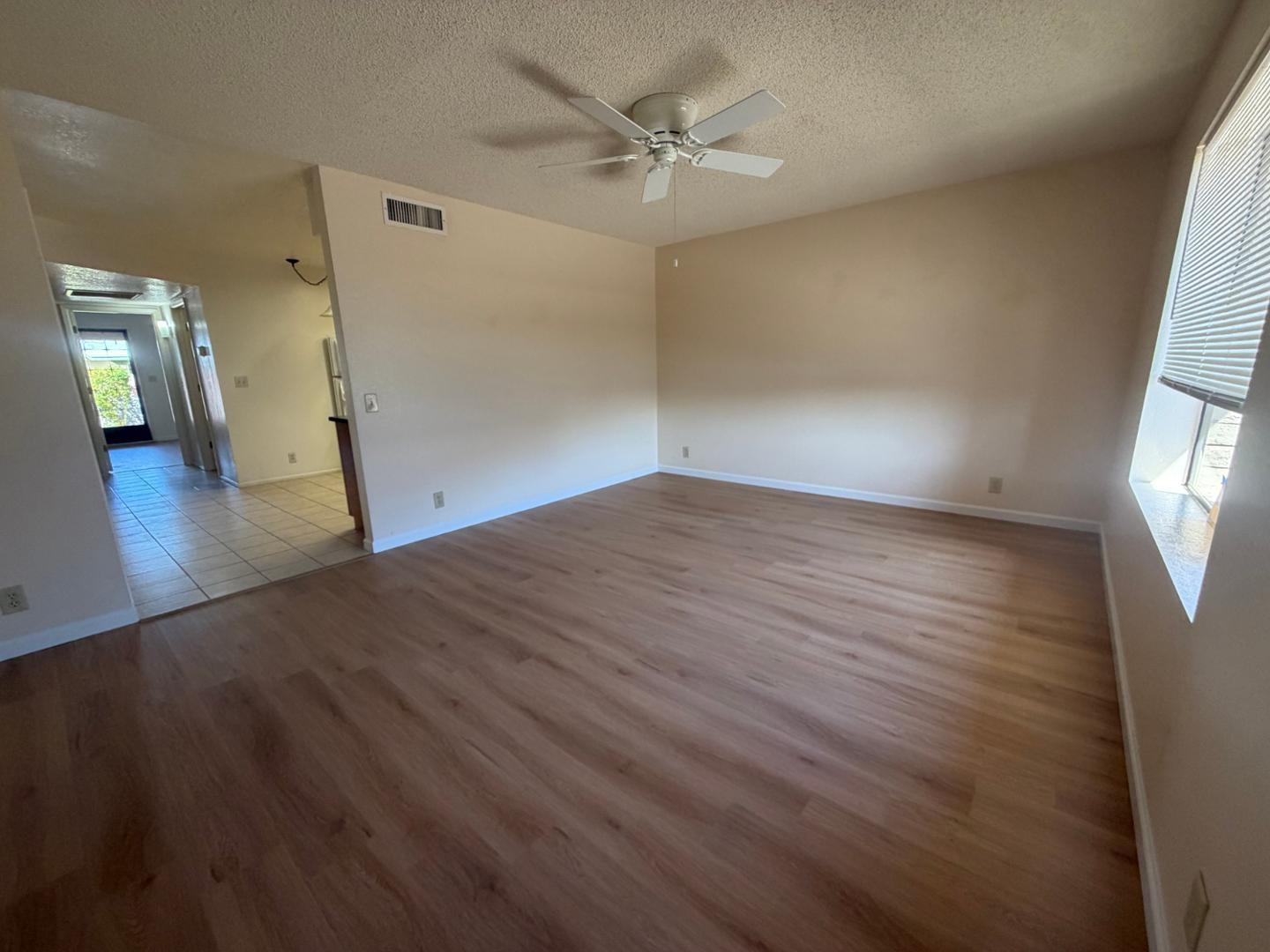 520 South Greenfield Road, Unit 41 Mesa, AZ 85206 - Photo 5 of 24 wooden floor in an empty room with a window