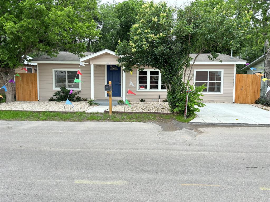 front view of a house next to a yard