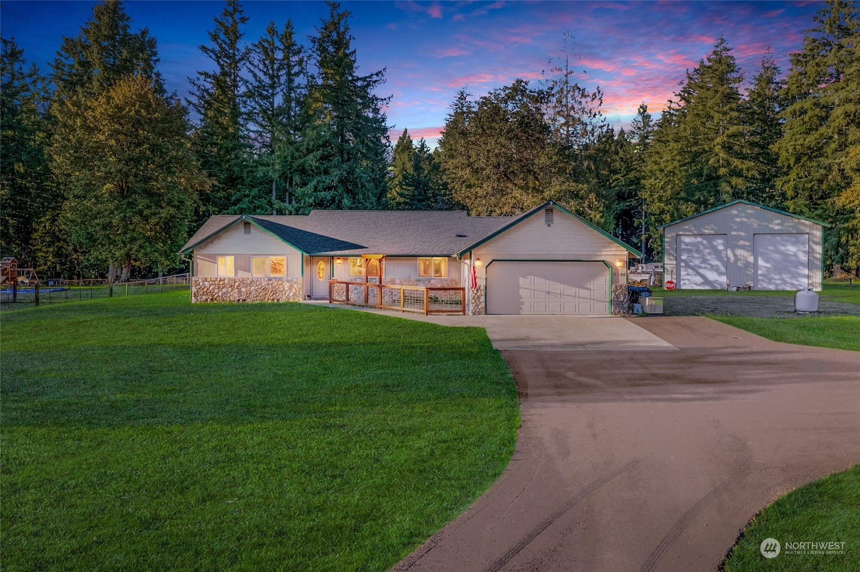 5520 133rd Avenue Southwest Rochester, WA 98579 - Photo 1 of 40 a aerial view of a house next to a big yard and large trees