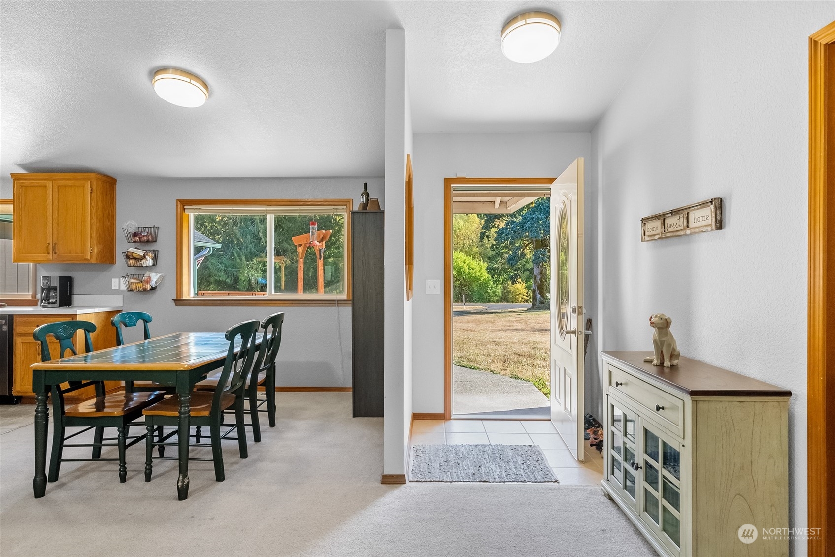 5520 133rd Avenue Southwest Rochester, WA 98579 - Photo 11 of 40 a view of a dining room with furniture and a window