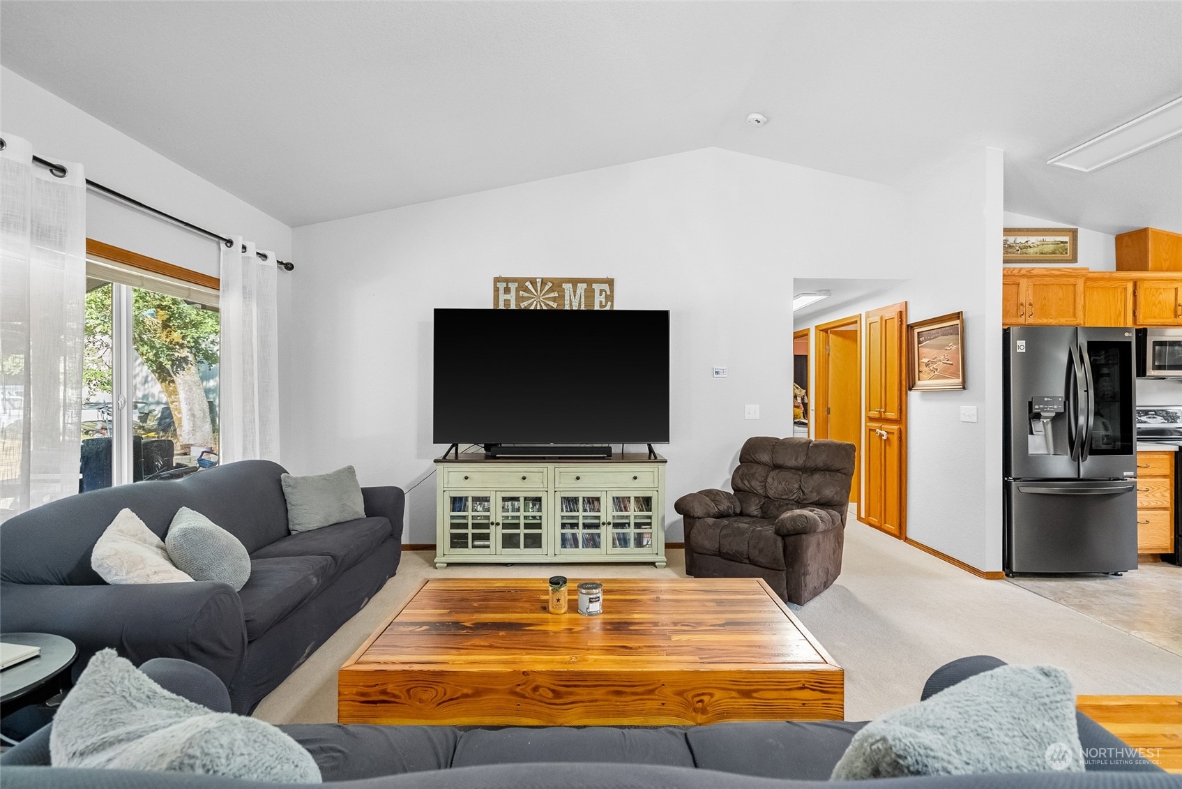 5520 133rd Avenue Southwest Rochester, WA 98579 - Photo 13 of 40 a living room with furniture and a flat screen tv