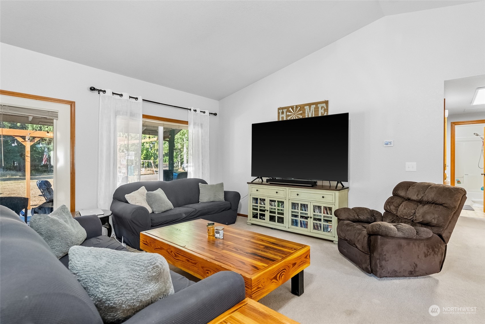 5520 133rd Avenue Southwest Rochester, WA 98579 - Photo 14 of 40 a living room with furniture and a flat screen tv