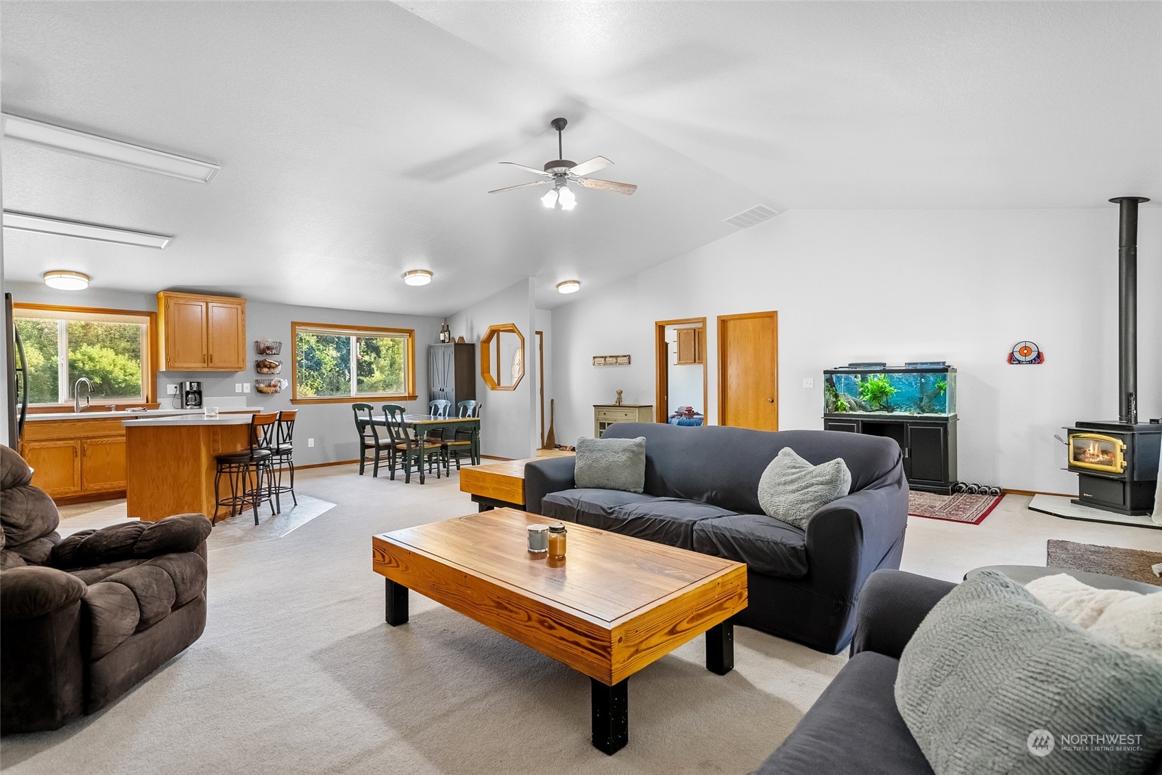 5520 133rd Avenue Southwest Rochester, WA 98579 - Photo 16 of 40 a living room with furniture and kitchen view