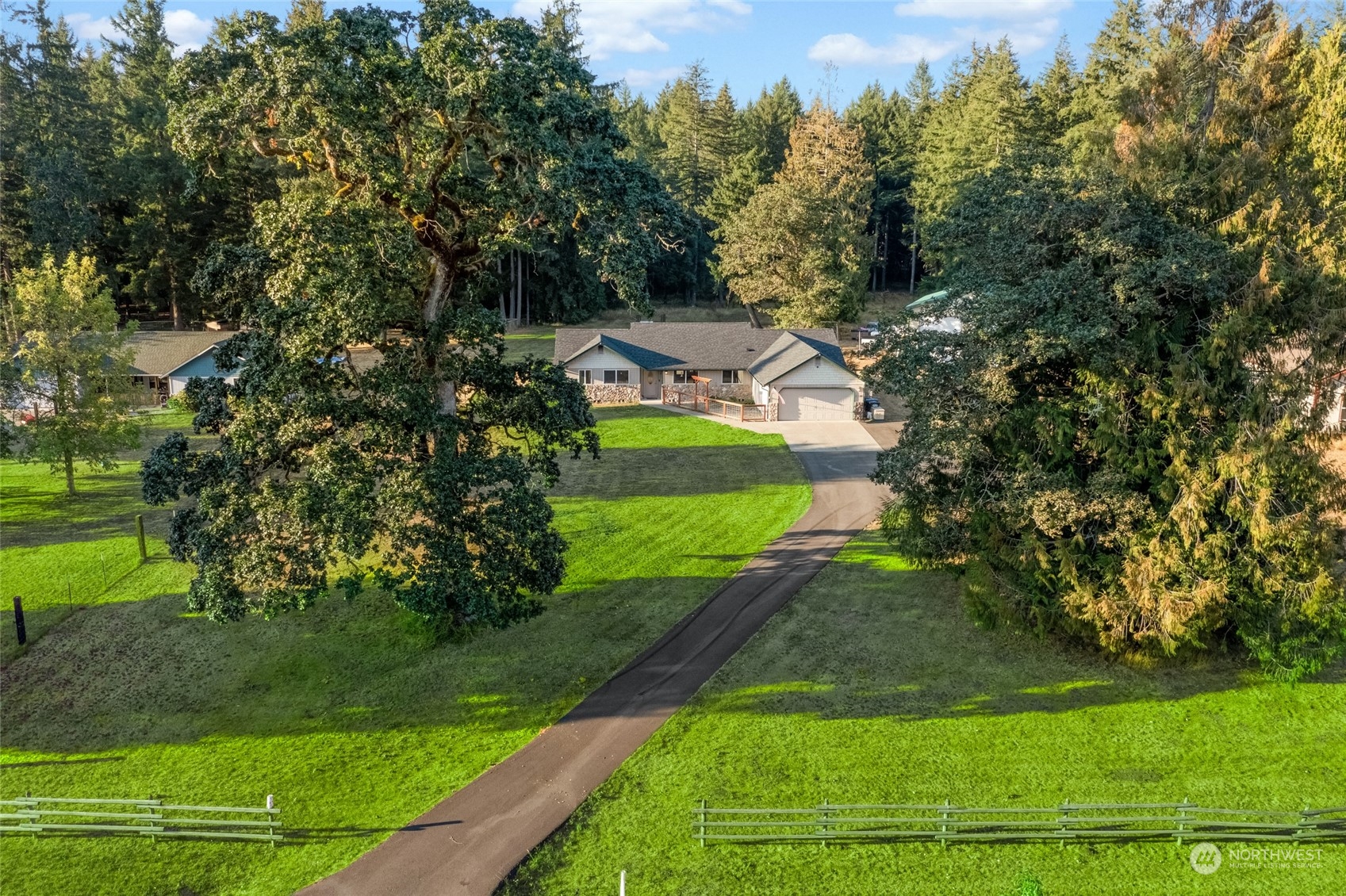 5520 133rd Avenue Southwest Rochester, WA 98579 - Photo 2 of 40 a view of a house with garden