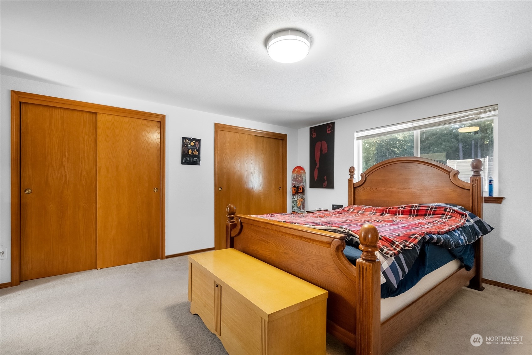 5520 133rd Avenue Southwest Rochester, WA 98579 - Photo 25 of 40 a bedroom with a bed and wooden floor