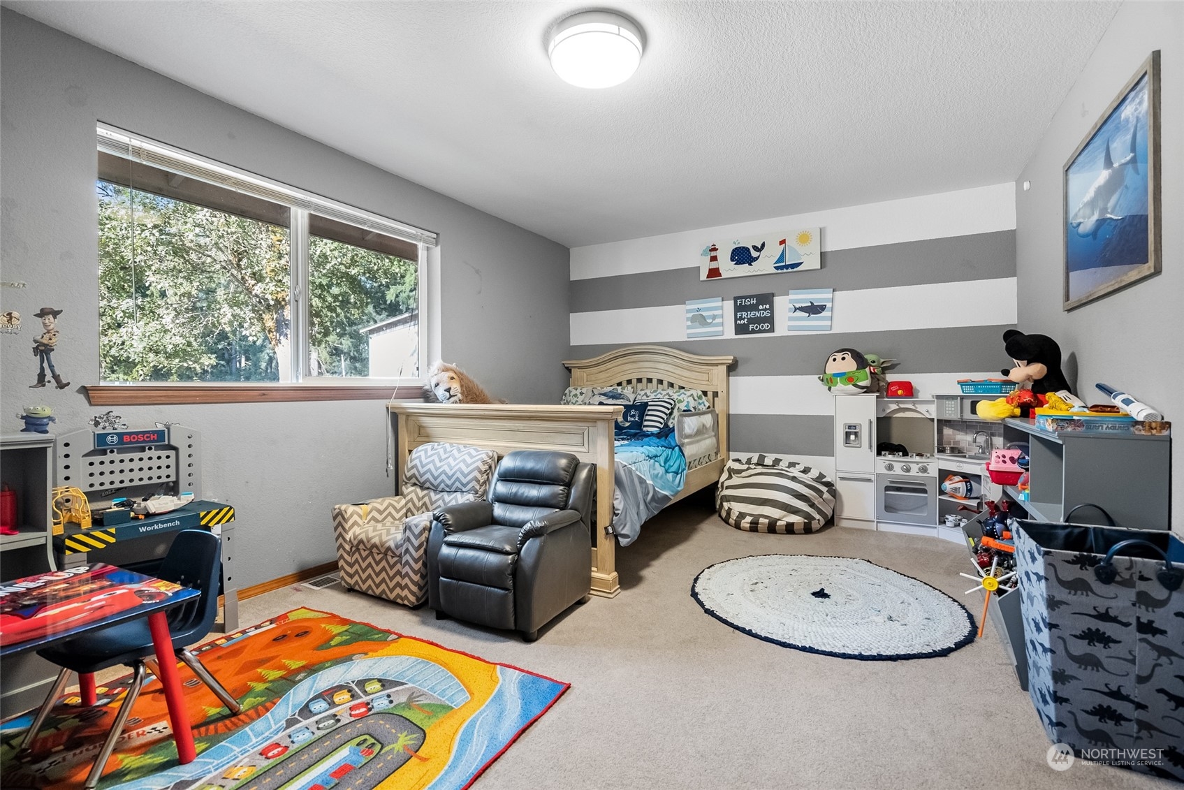 5520 133rd Avenue Southwest Rochester, WA 98579 - Photo 27 of 40 a room with furniture a rug toys and a window