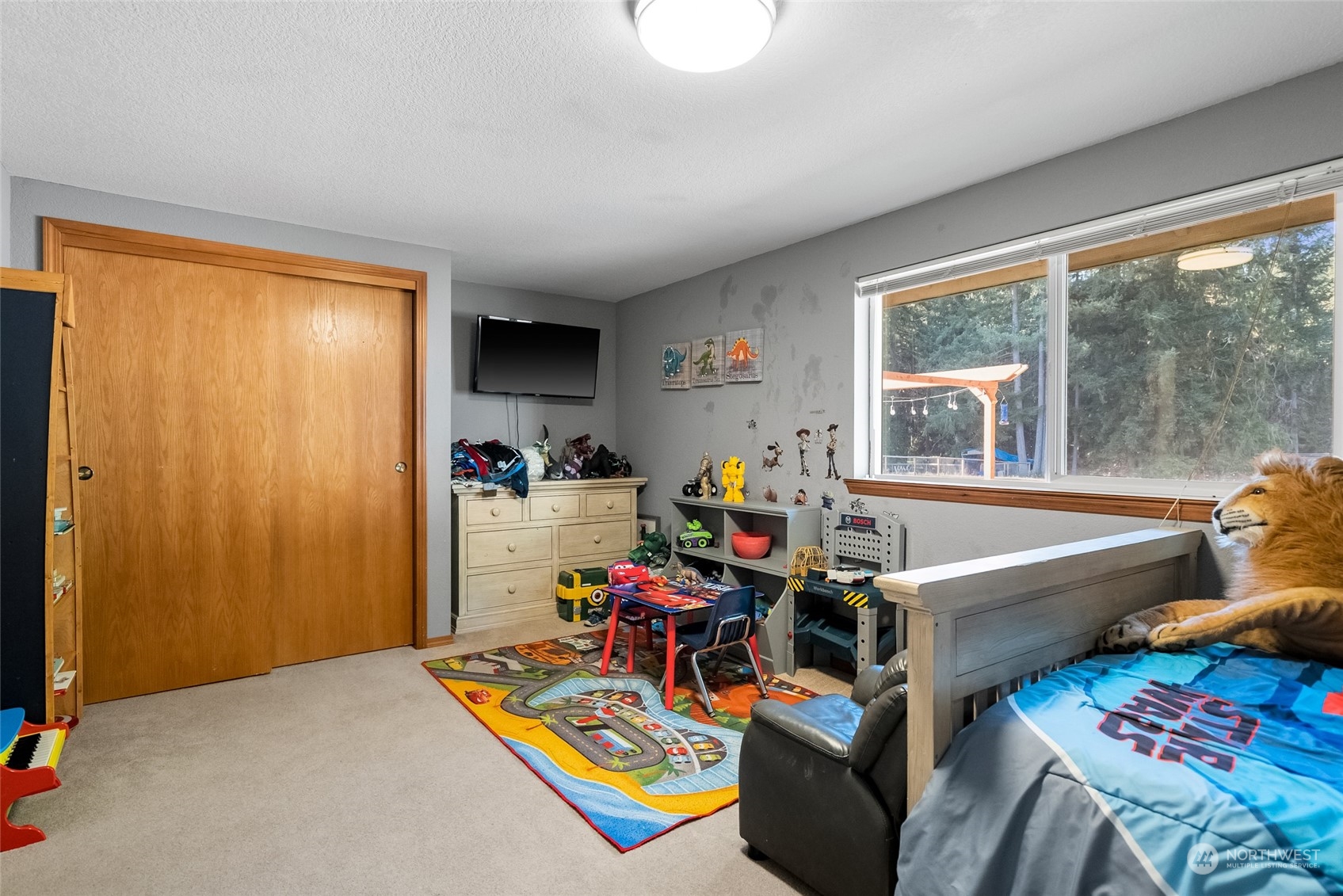 5520 133rd Avenue Southwest Rochester, WA 98579 - Photo 28 of 40 a living room with furniture and a window