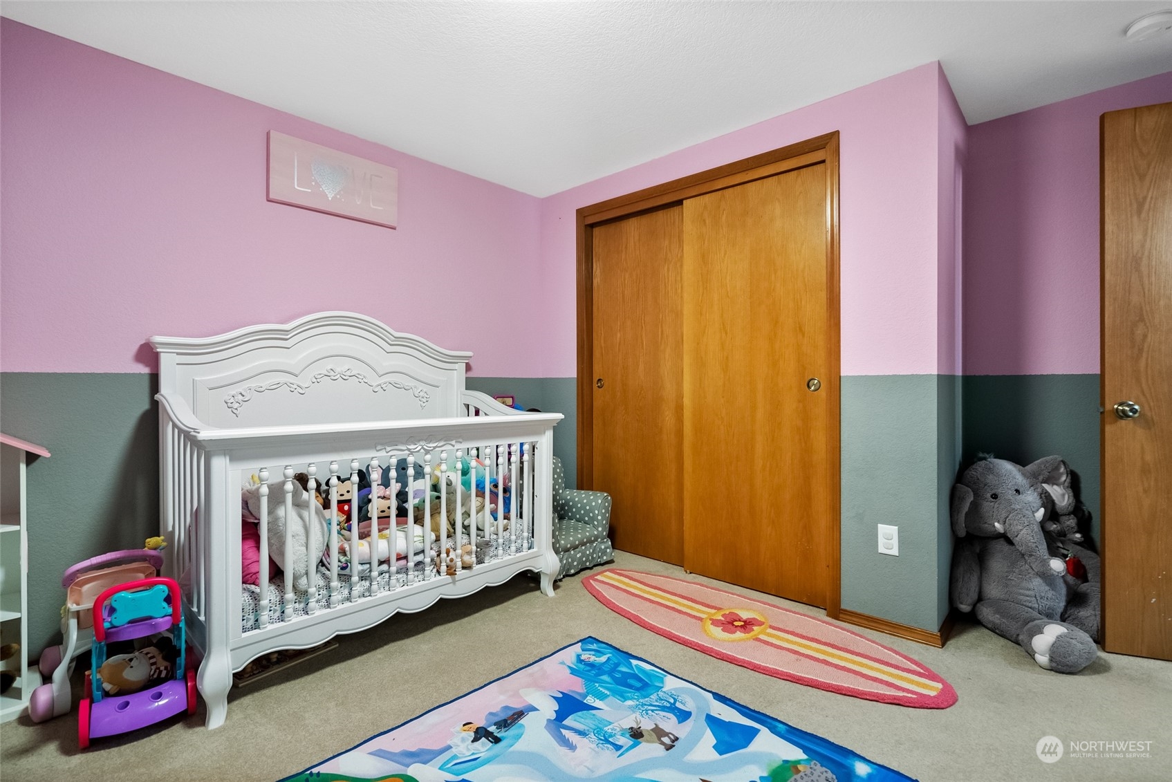 5520 133rd Avenue Southwest Rochester, WA 98579 - Photo 31 of 40 a bedroom with furniture and a baby crib