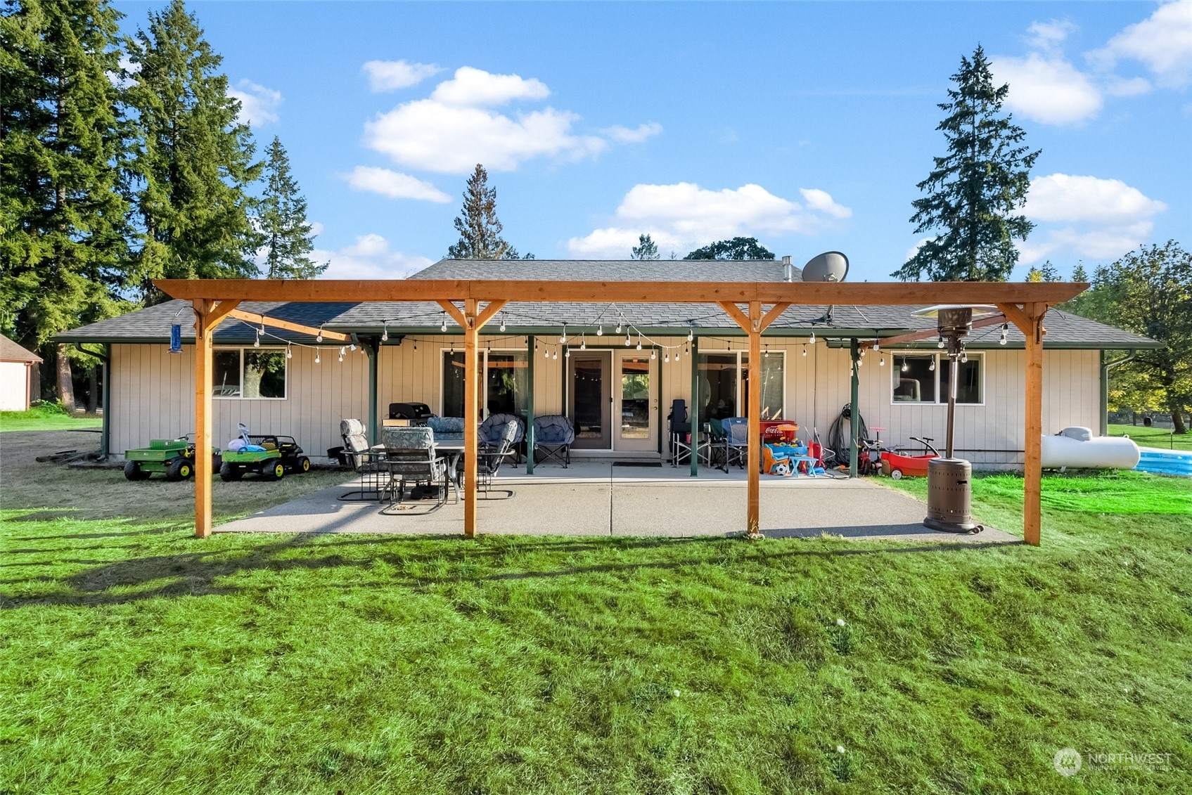 5520 133rd Avenue Southwest Rochester, WA 98579 - Photo 34 of 40 a view of a house with a yard and sitting area
