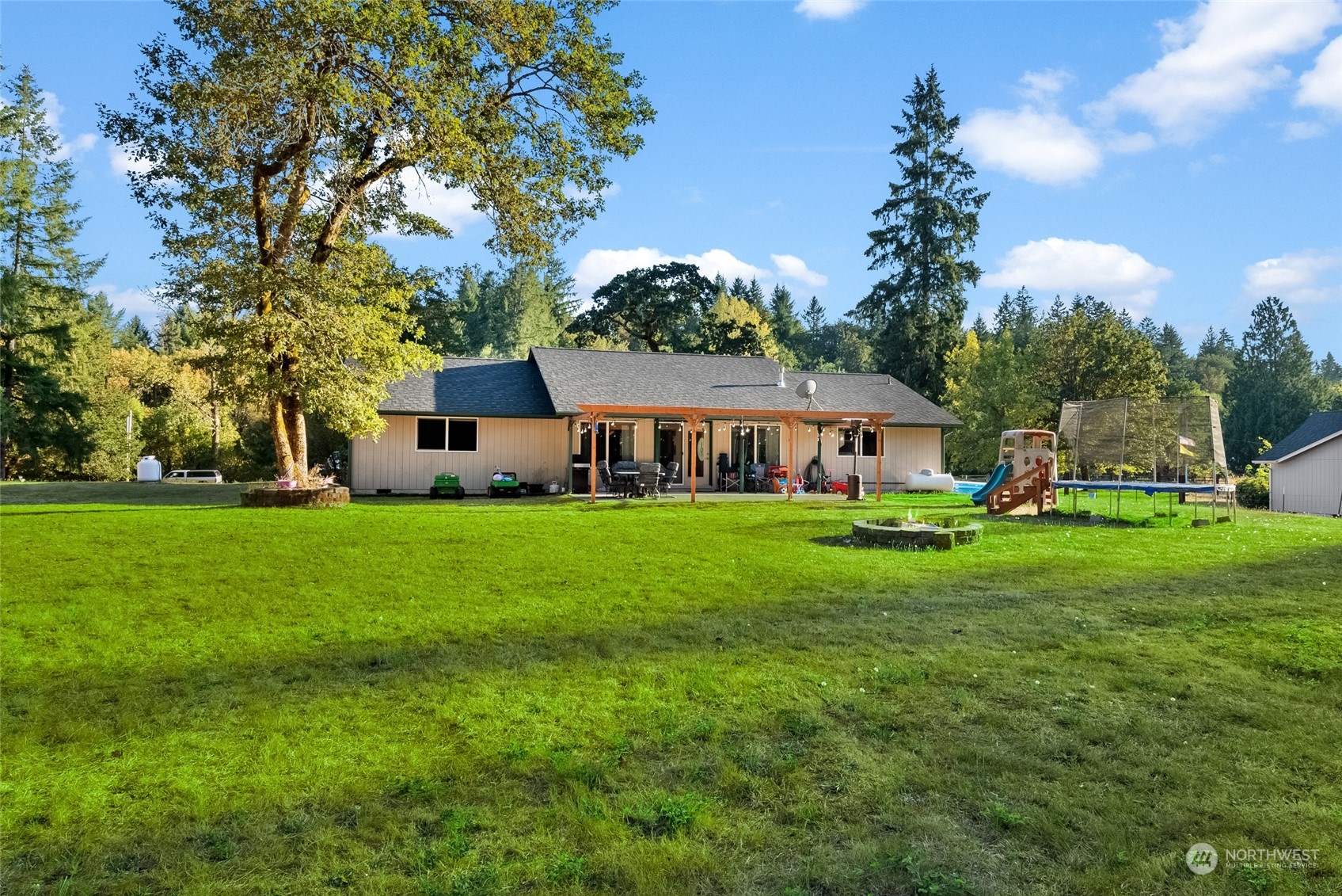 5520 133rd Avenue Southwest Rochester, WA 98579 - Photo 36 of 40 a front view of house with yard and green space