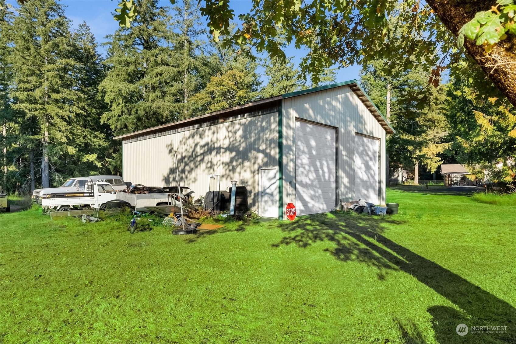 5520 133rd Avenue Southwest Rochester, WA 98579 - Photo 37 of 40 a view of a house with a backyard