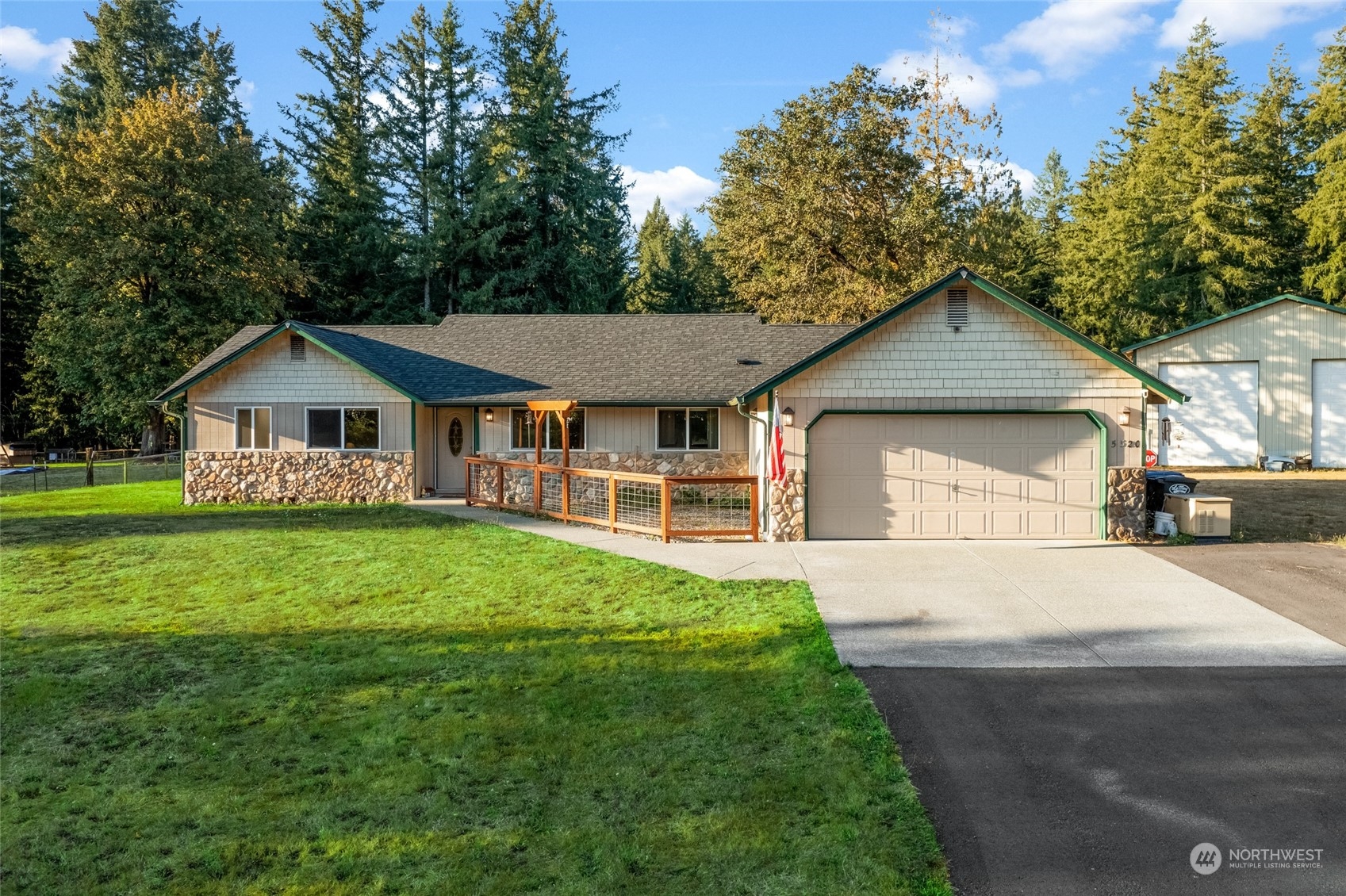 5520 133rd Avenue Southwest Rochester, WA 98579 - Photo 7 of 40 a front view of a house with yard and green space