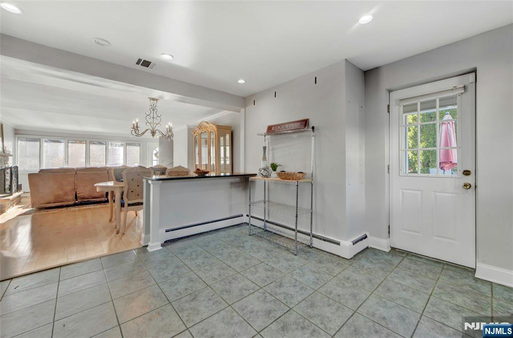 683 Eastern Court Ridgewood, NJ 07450 - Photo 12 of 25 a view of a kitchen with furniture and a window