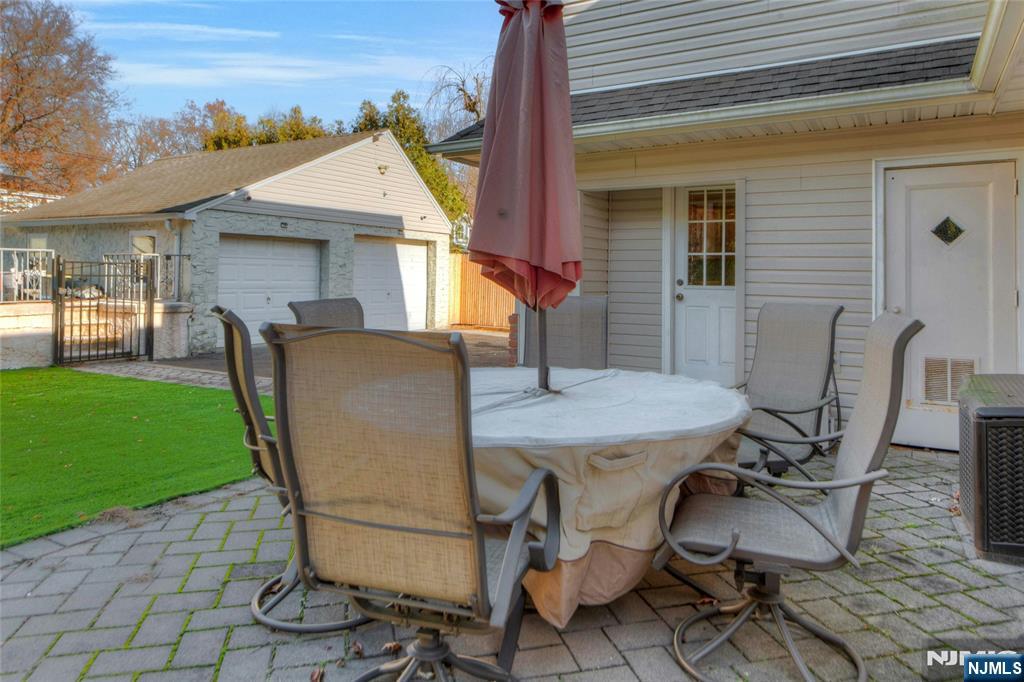 683 Eastern Court Ridgewood, NJ 07450 - Photo 24 of 25 a view of a patio with table and chairs