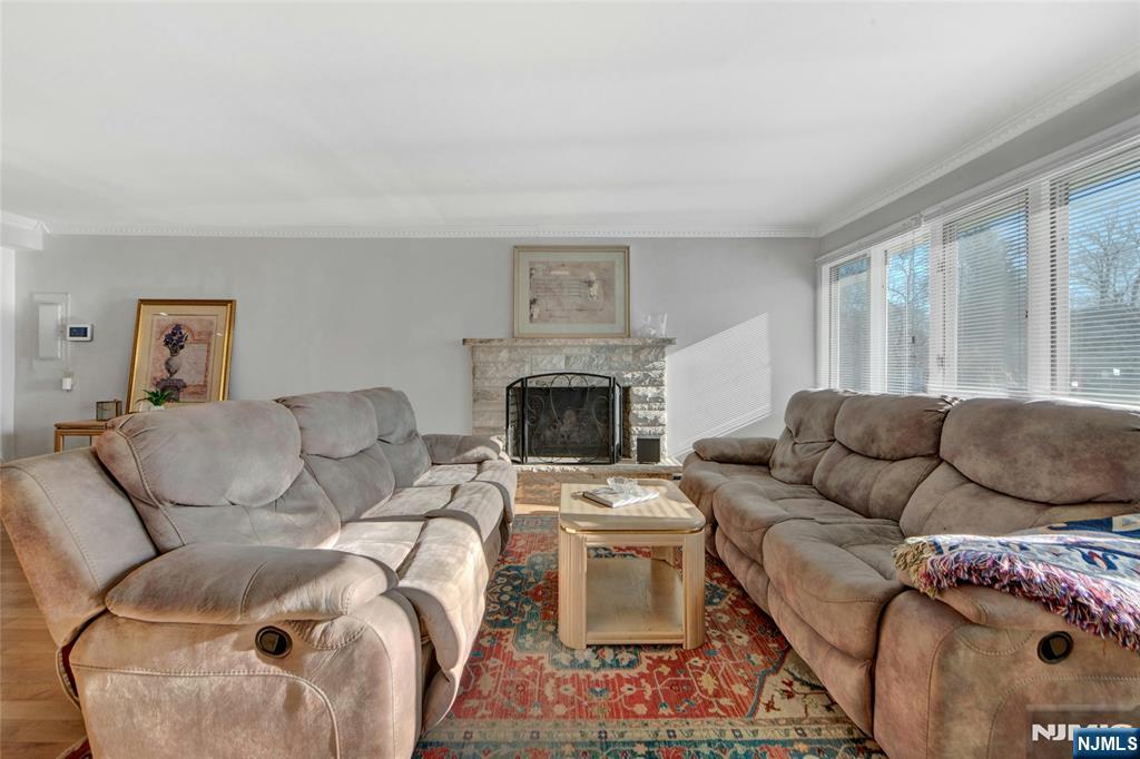 683 Eastern Court Ridgewood, NJ 07450 - Photo 3 of 25 a living room with furniture and a fireplace