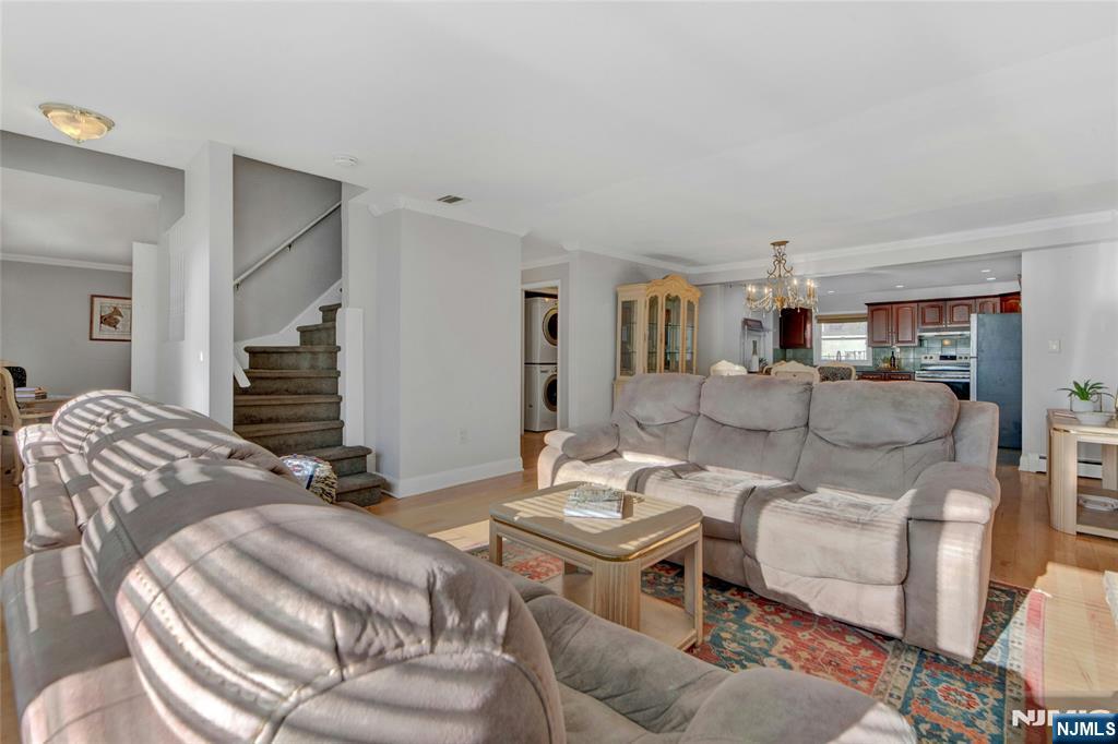 683 Eastern Court Ridgewood, NJ 07450 - Photo 4 of 25 a living room with furniture and a wooden floor