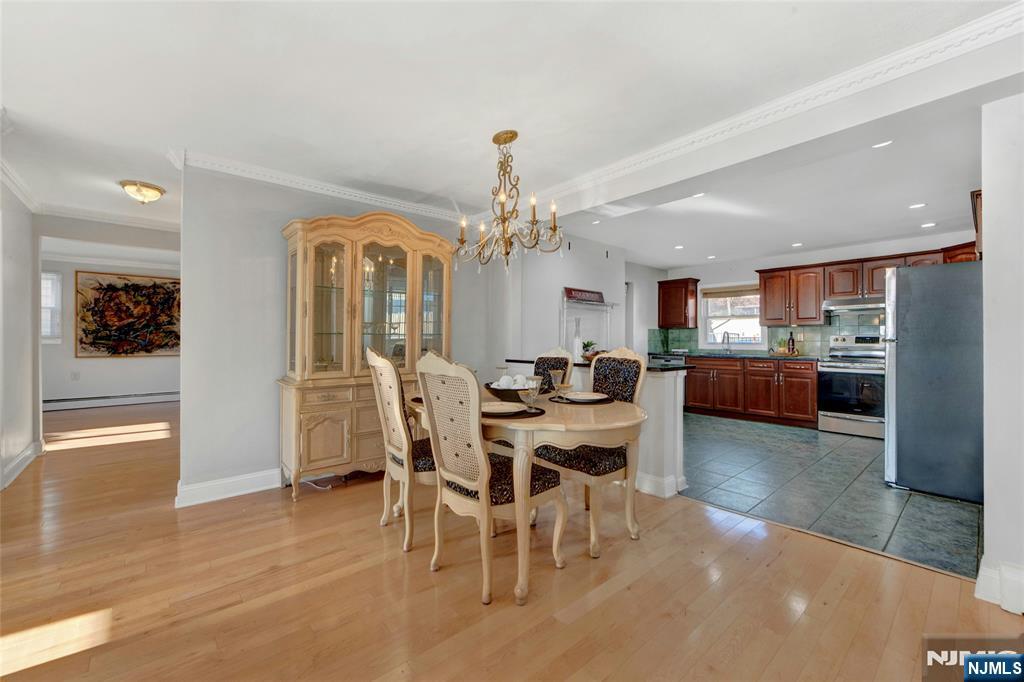 683 Eastern Court Ridgewood, NJ 07450 - Photo 5 of 25 a view of a dining room with furniture and a chandelier