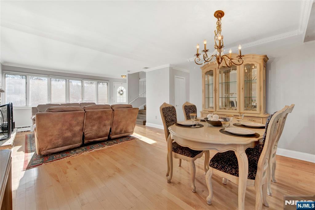 683 Eastern Court Ridgewood, NJ 07450 - Photo 8 of 25 a view of a dining room with furniture and a chandelier