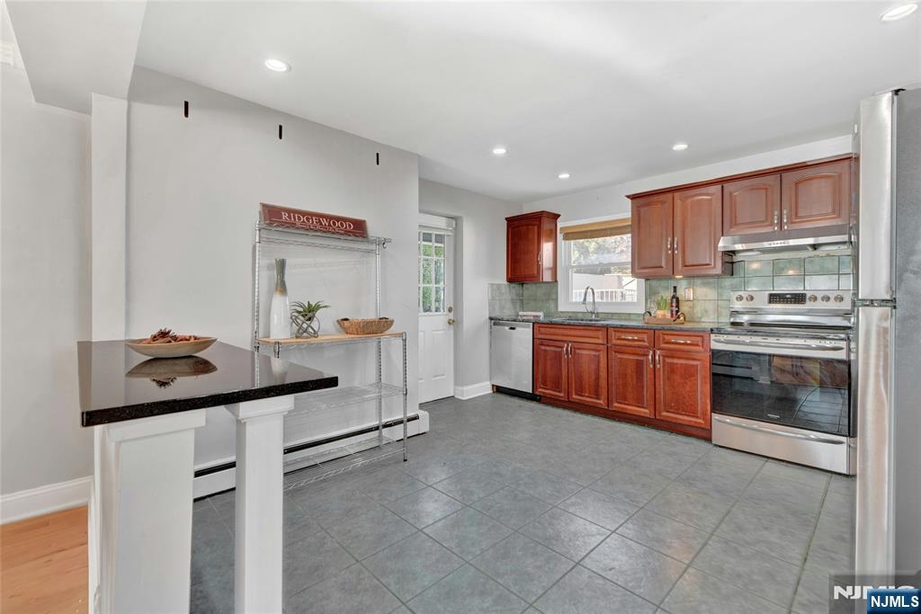 683 Eastern Court Ridgewood, NJ 07450 - Photo 9 of 25 a kitchen with a sink and cabinets