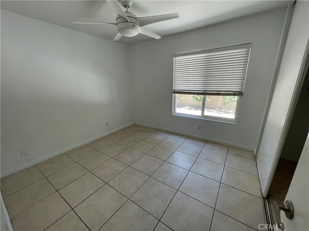 134 Clearbrook, Unit 14 Irvine, CA 92614 - Photo 6 of 9 an empty room with windows