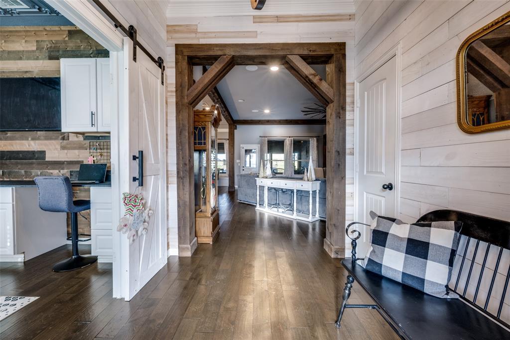 7417 Green Mesa Road Ponder, TX 76259 - Photo 5 of 39 a view of a hallway with wooden floor and dining room