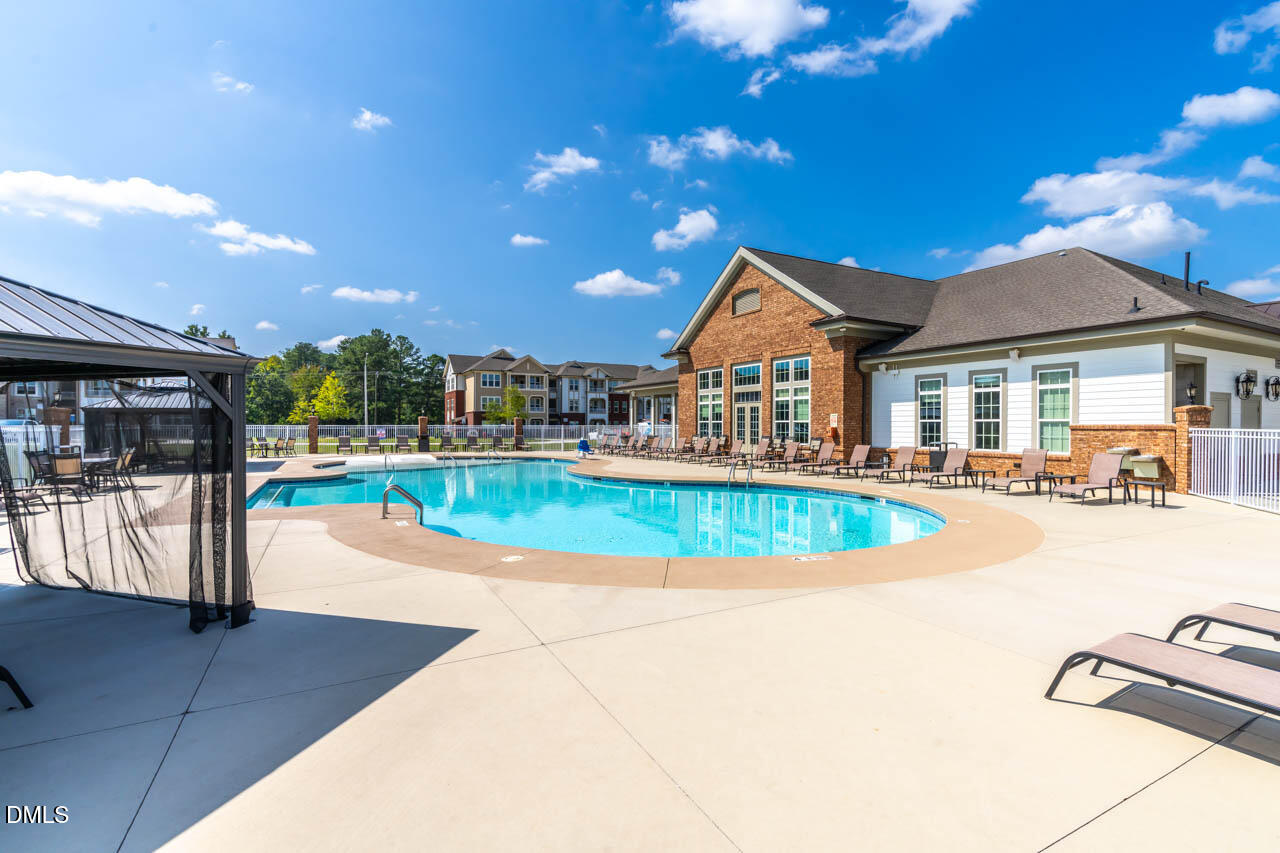 2421 Chert Lane Raleigh, NC 27610 - Photo 51 of 97 a view of a house with swimming pool and sitting area
