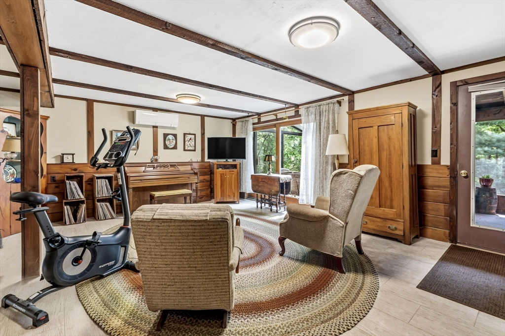 788 Burts Pit Road Northampton, MA 01062 - Photo 30 of 42 a living room with furniture and a floor to ceiling window