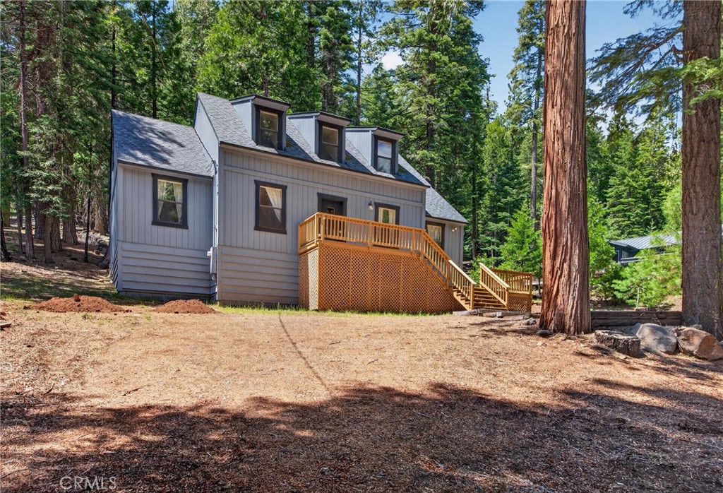 627 Cedar Canyon Road Lake Almanor, CA 96137 - Photo 1 of 34 a front view of a house with a yard