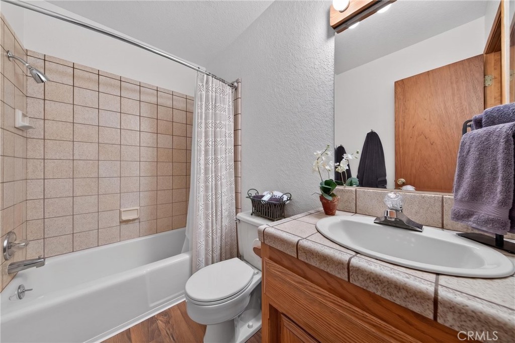 627 Cedar Canyon Road Lake Almanor, CA 96137 - Photo 14 of 34 a bathroom with a sink toilet and shower