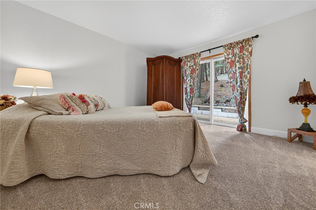 627 Cedar Canyon Road Lake Almanor, CA 96137 - Photo 16 of 34 a bedroom with a bed and a window