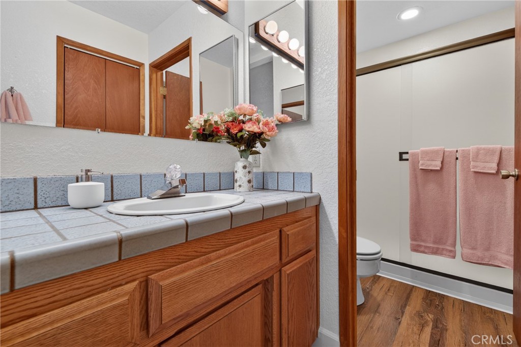 627 Cedar Canyon Road Lake Almanor, CA 96137 - Photo 17 of 34 a bathroom with a sink a vanity and a mirror