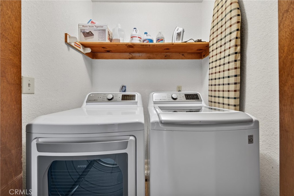 627 Cedar Canyon Road Lake Almanor, CA 96137 - Photo 18 of 34 a utility room with dryer and washer