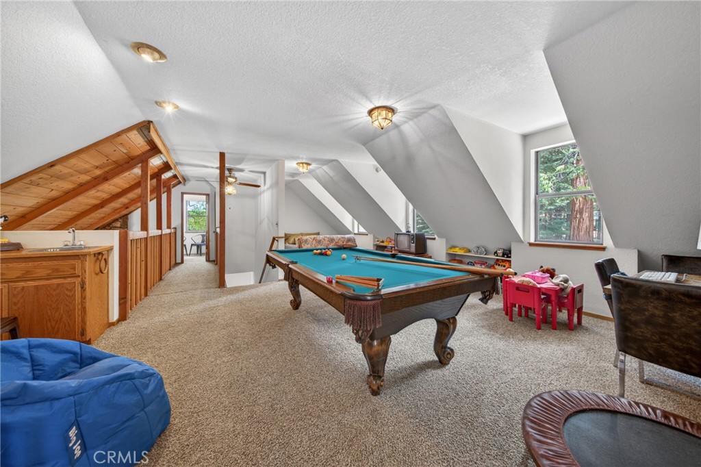 627 Cedar Canyon Road Lake Almanor, CA 96137 - Photo 22 of 34 a living room with furniture pool table and bed