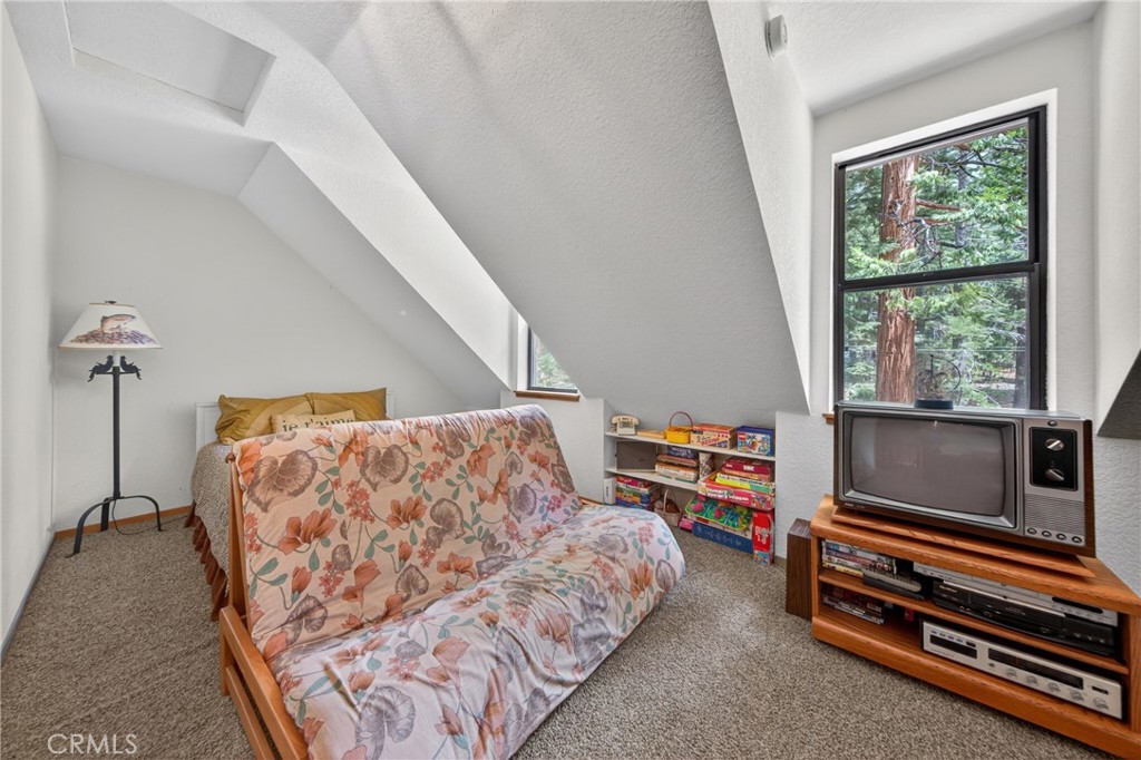 627 Cedar Canyon Road Lake Almanor, CA 96137 - Photo 23 of 34 a bedroom with furniture and a window